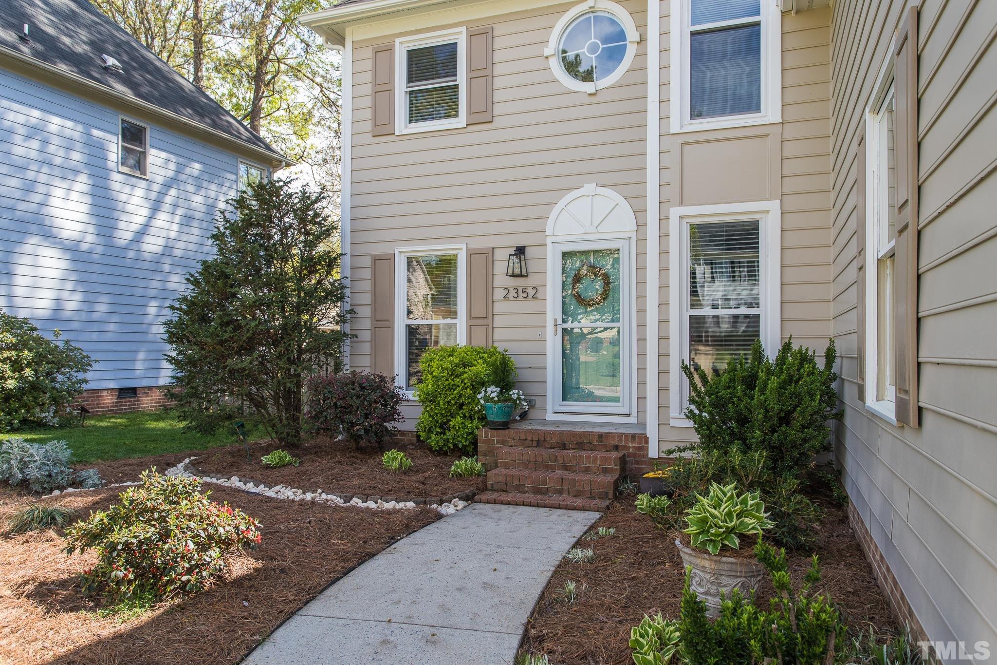 2352 Declaration Drive Raleigh, NC 27615 - Photo 3 of 28 a front view of a house with garden