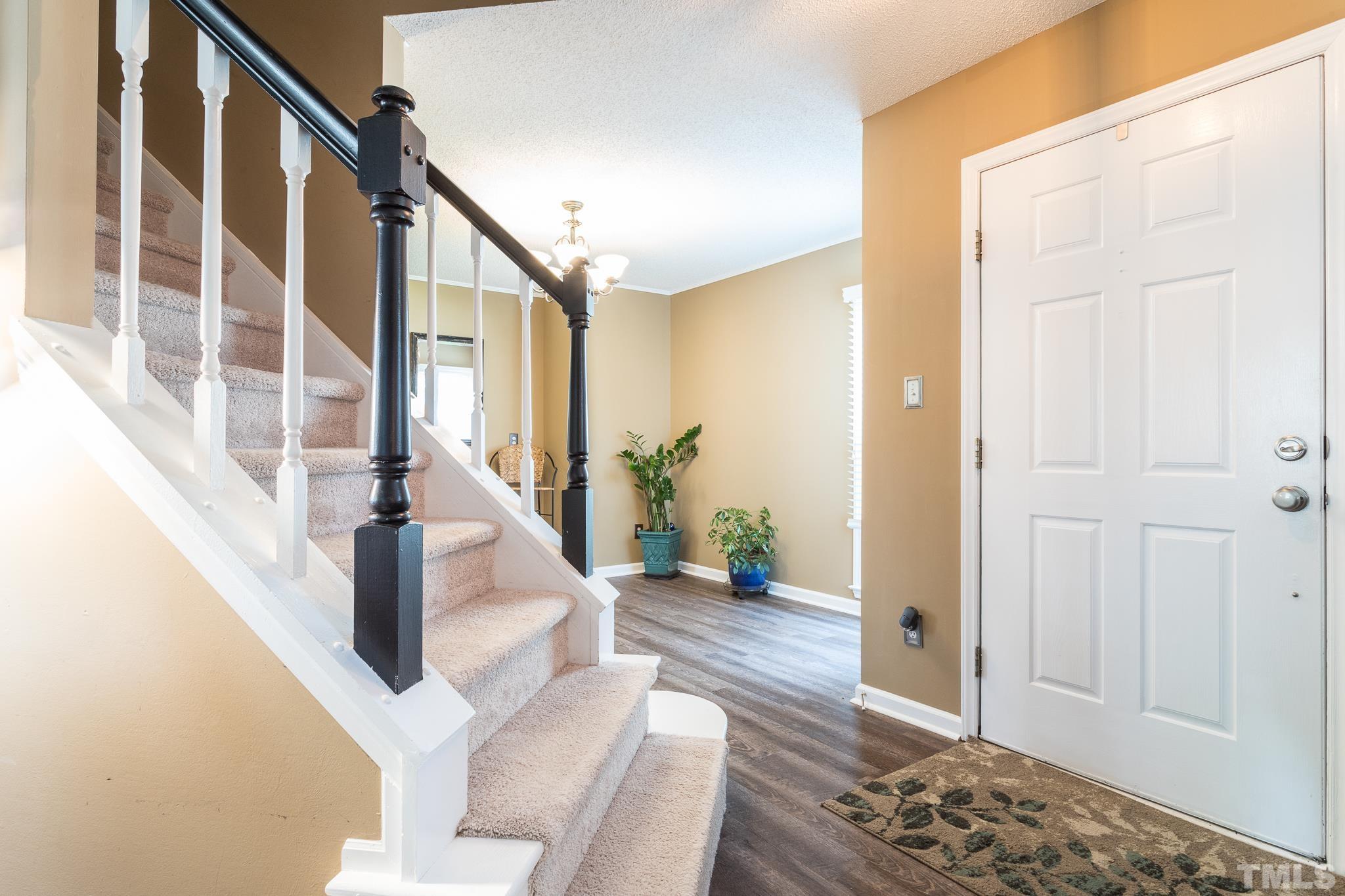 2352 Declaration Drive Raleigh, NC 27615 - Photo 4 of 28 a view of entryway and hall with wooden floor