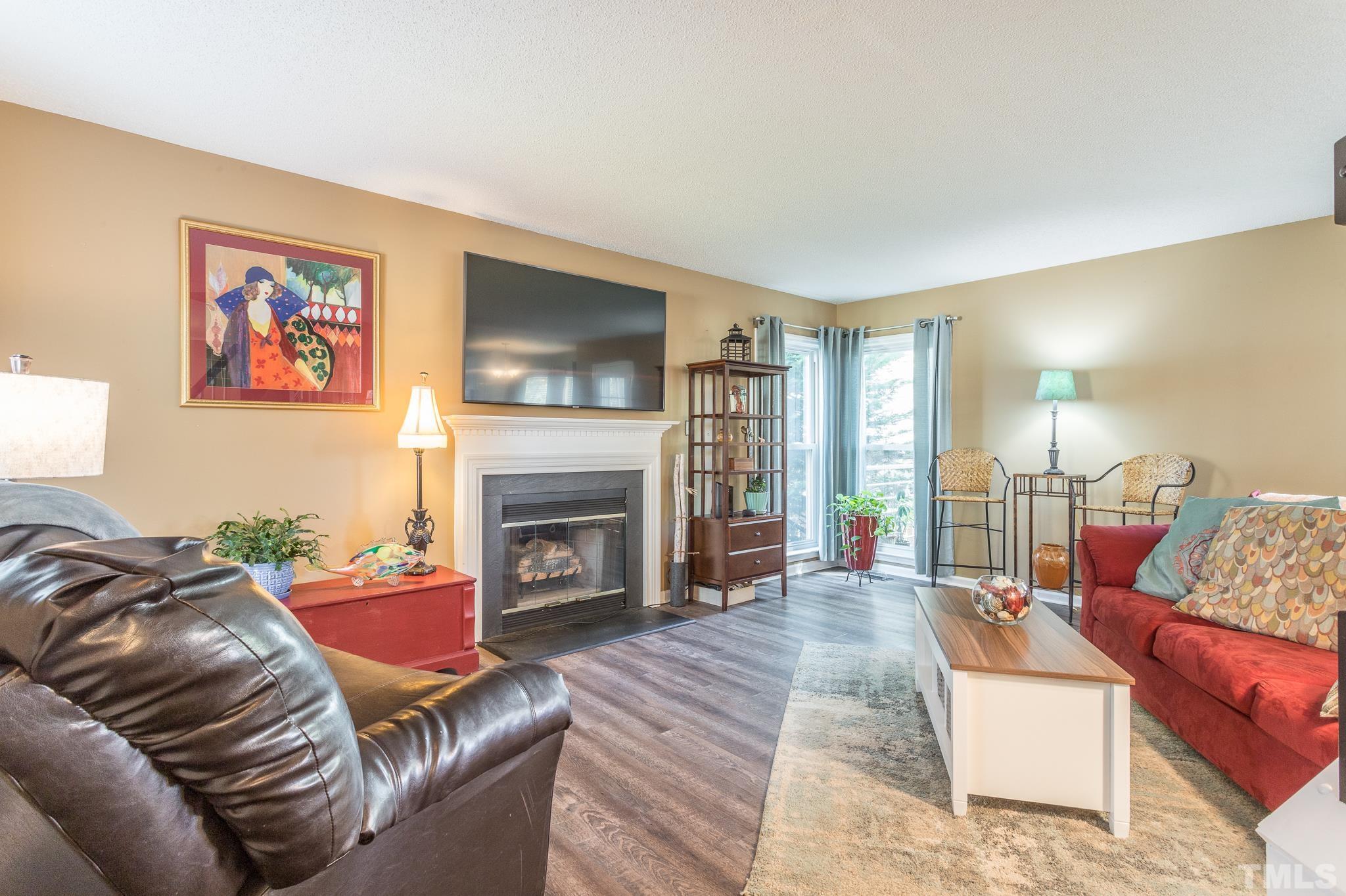 2352 Declaration Drive Raleigh, NC 27615 - Photo 6 of 28 a living room with furniture and a fireplace