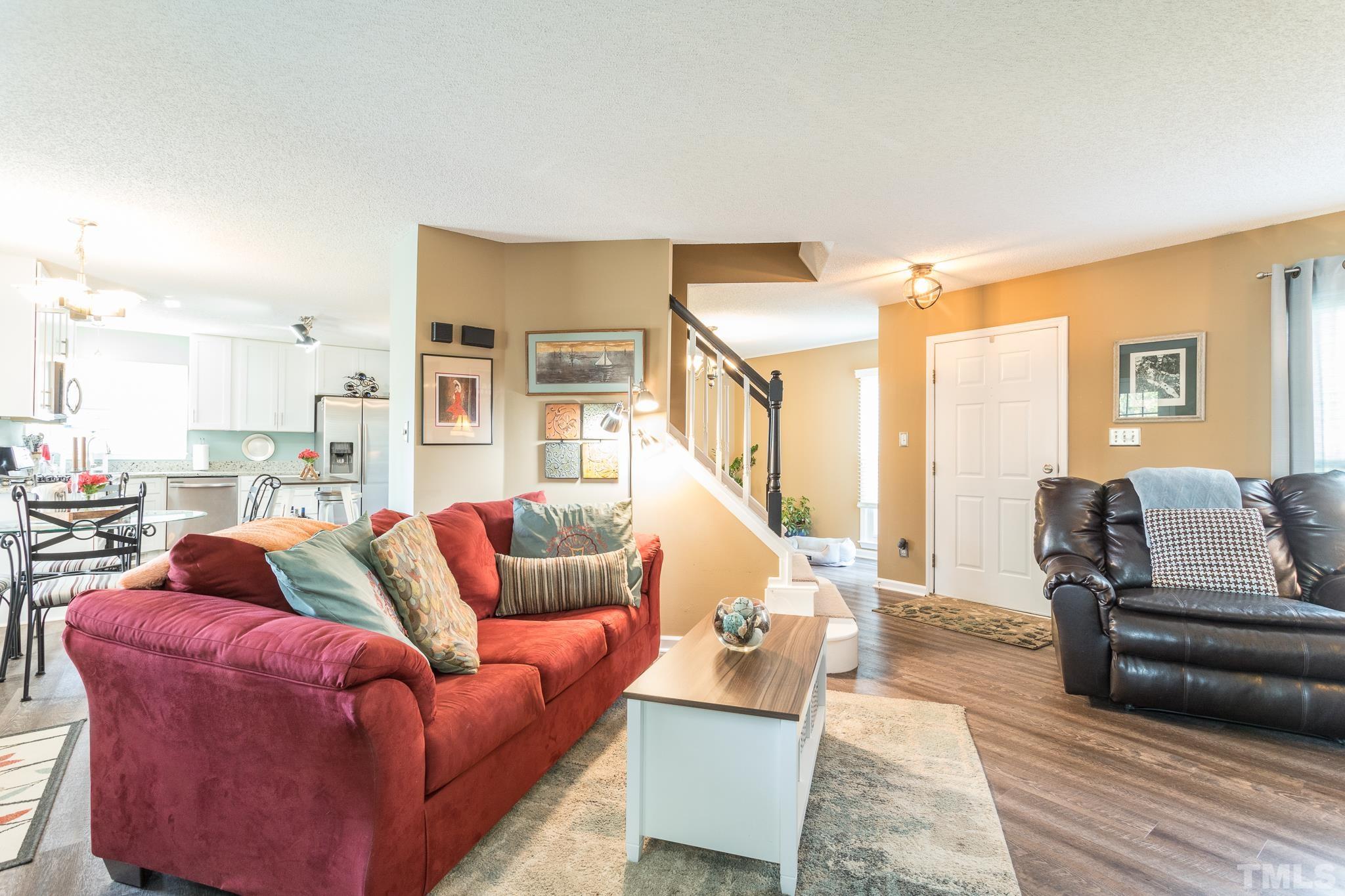 2352 Declaration Drive Raleigh, NC 27615 - Photo 7 of 28 a living room with furniture wooden floor and a large window