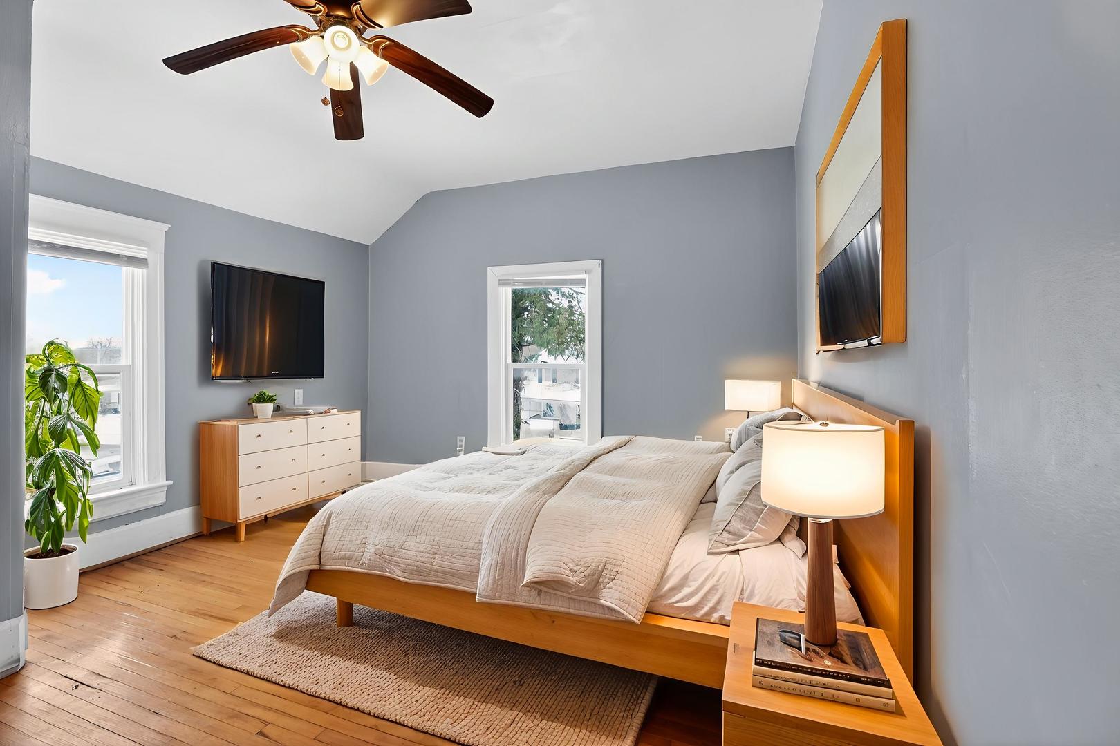 1250 West American Street Freeport, IL 61032 - Photo 12 of 23 a bedroom with a bed and a flat screen tv