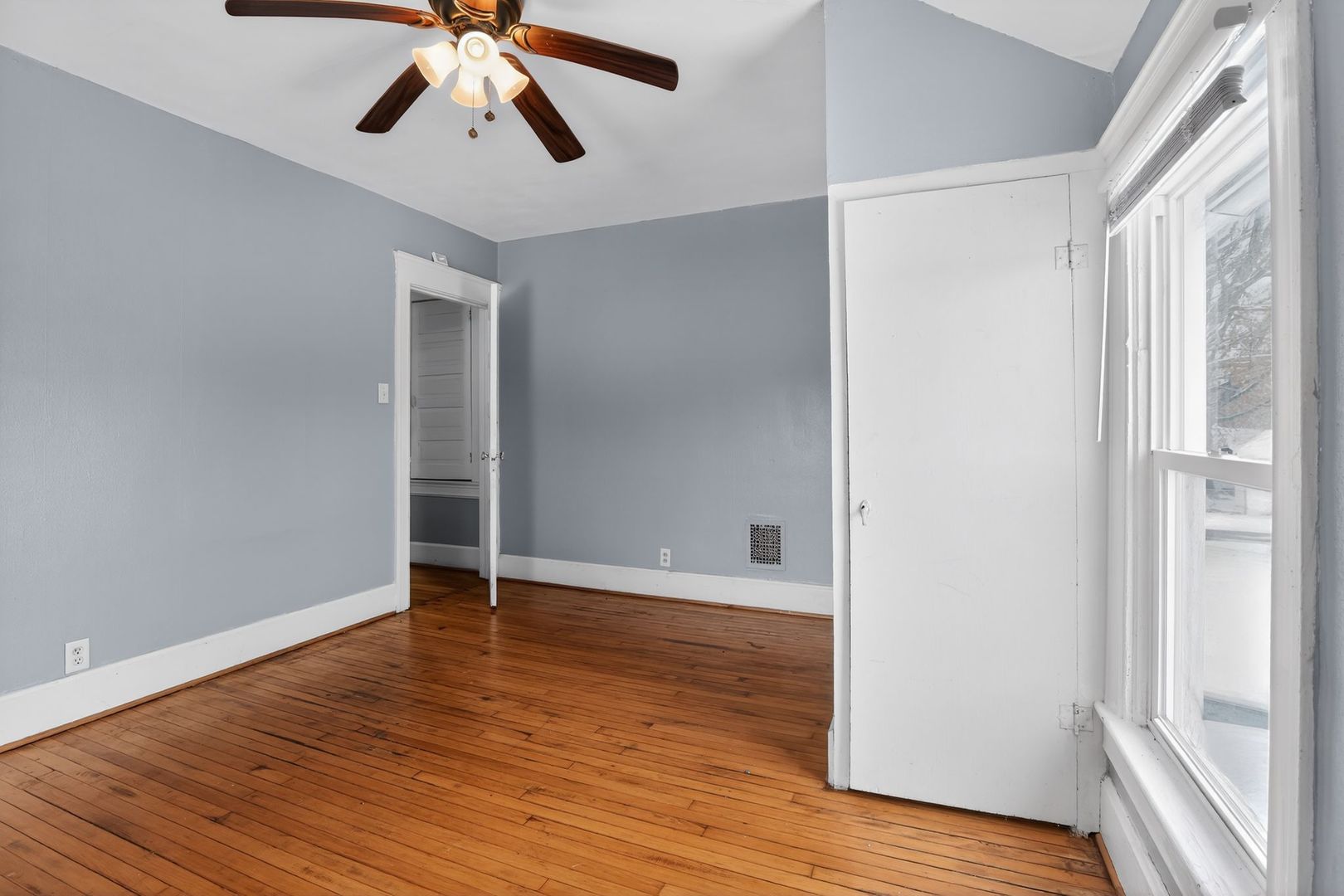 1250 West American Street Freeport, IL 61032 - Photo 13 of 23 a view of an empty room and wooden floor
