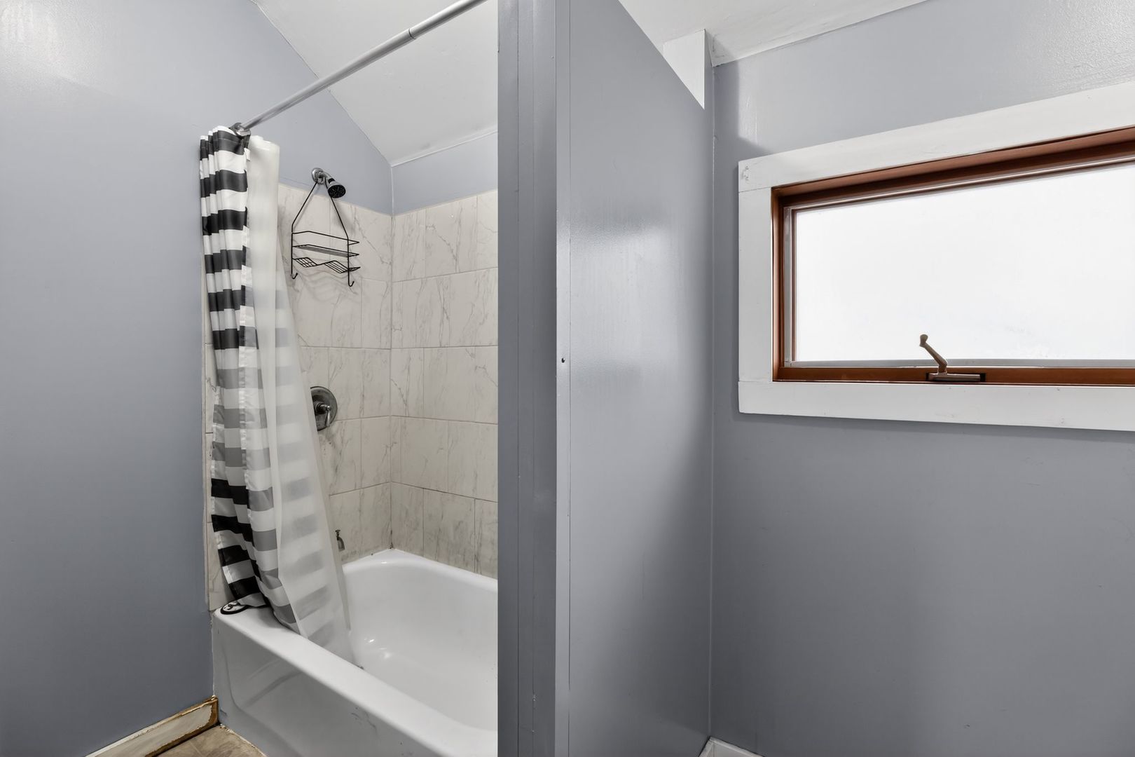 1250 West American Street Freeport, IL 61032 - Photo 16 of 23 a bathroom with a bathtub and a shower