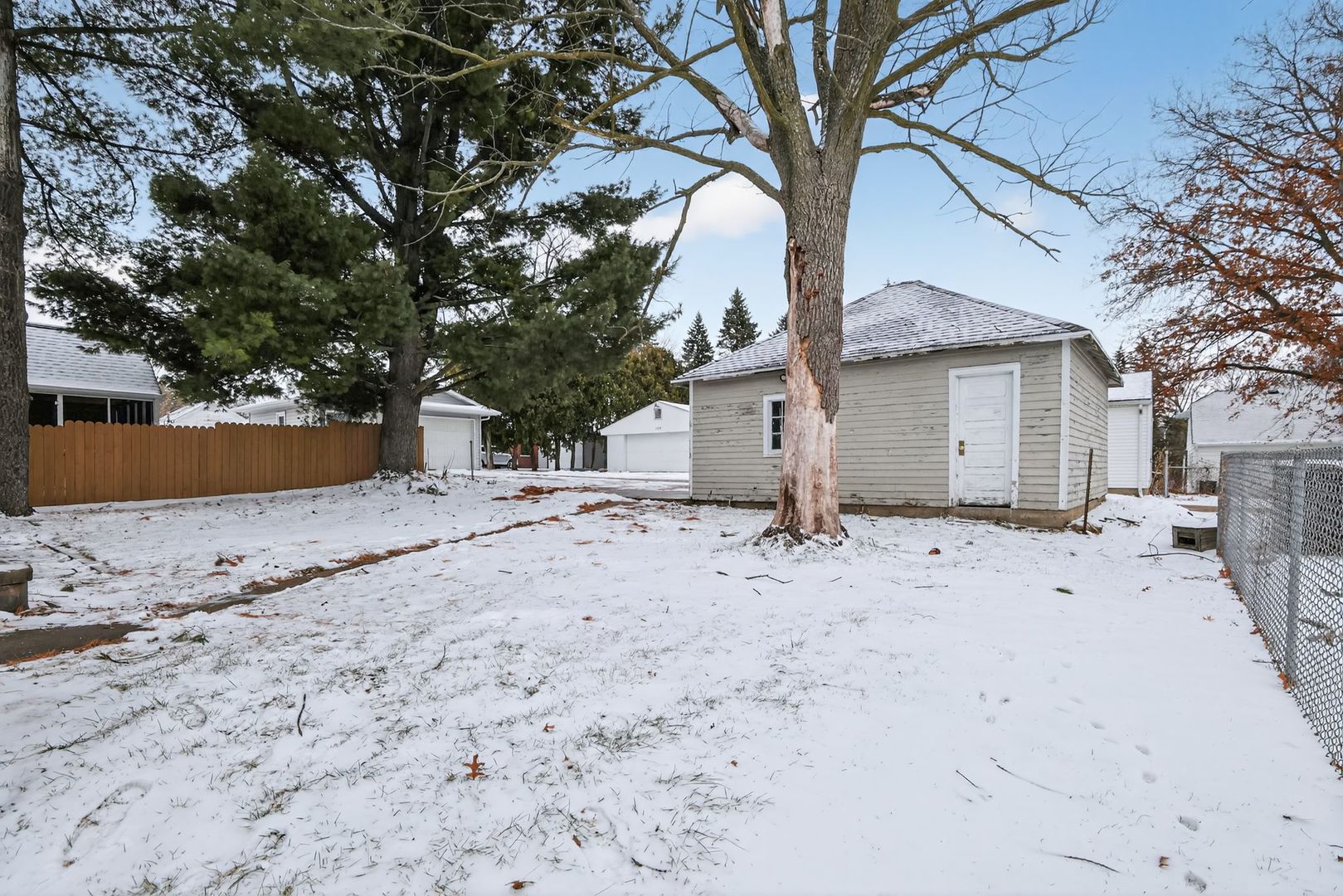 1250 West American Street Freeport, IL 61032 - Photo 22 of 23 a view of a yard with a tree