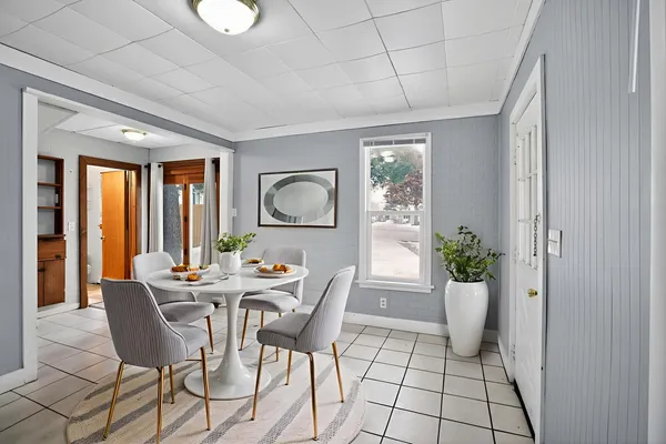 a view of a dining room with furniture window and outside view