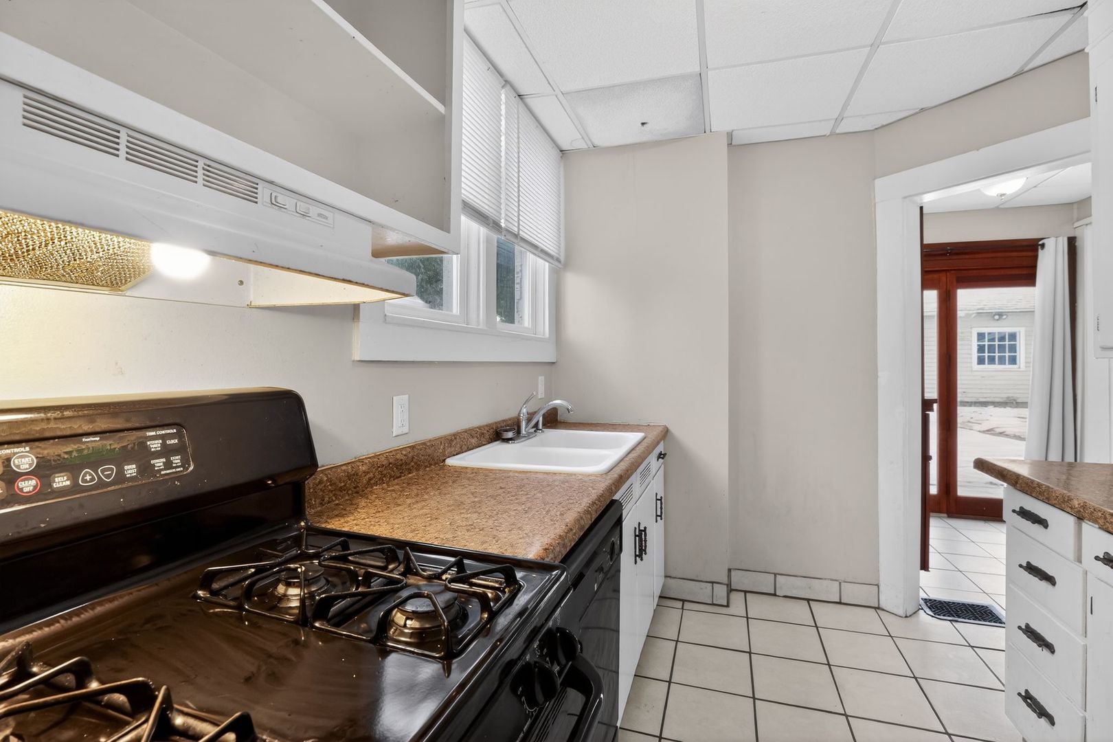 1250 West American Street Freeport, IL 61032 - Photo 9 of 23 a view of a kitchen with workspace and stove