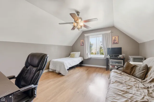 a bedroom with furniture or bed and a flat screen tv