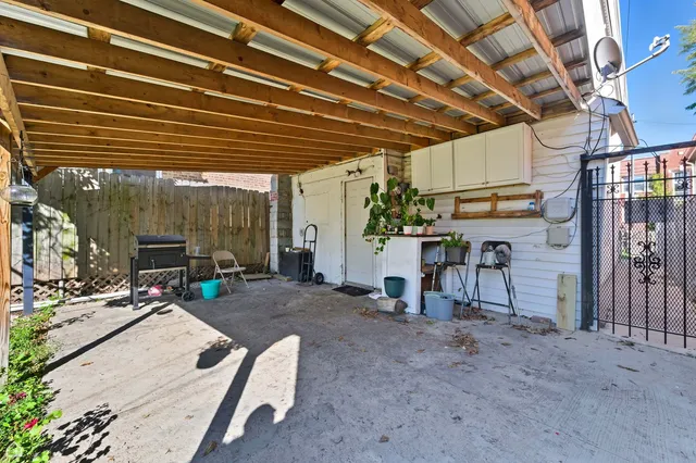 a view of a backyard with sitting area