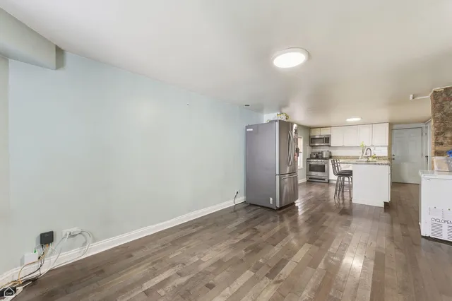 a view of kitchen with wooden floor