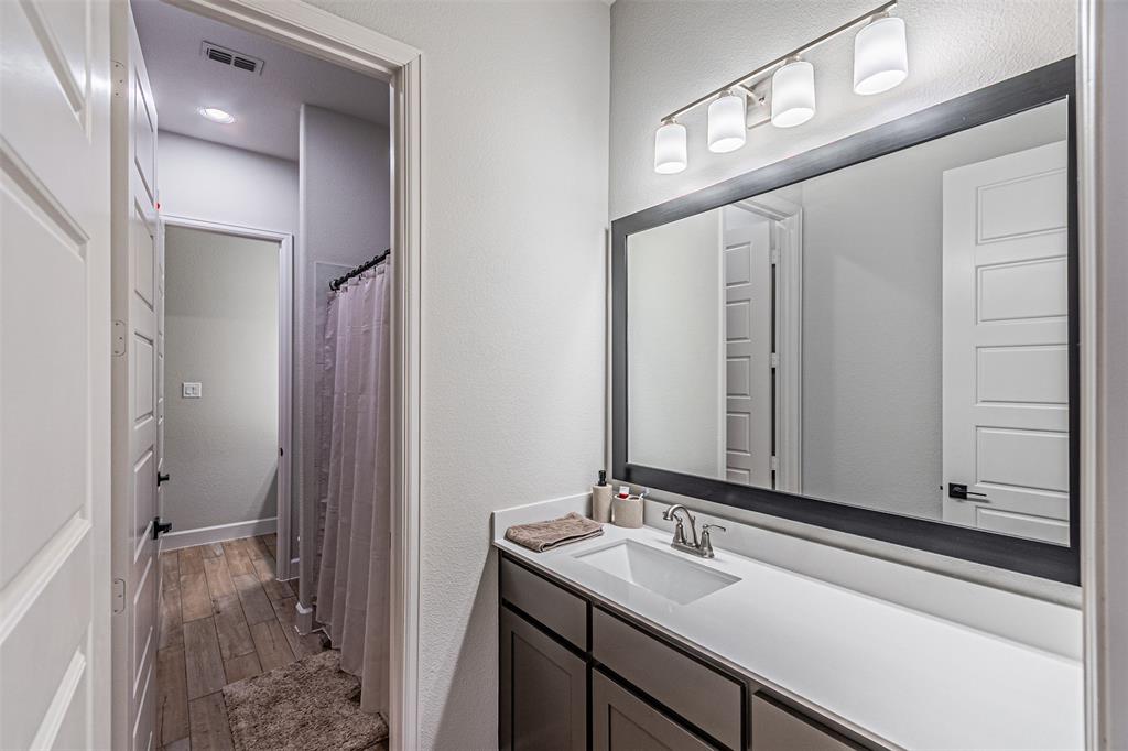 116 Derrett Lane Rhome, TX 76078 - Photo 19 of 30 a bathroom with a sink and a mirror