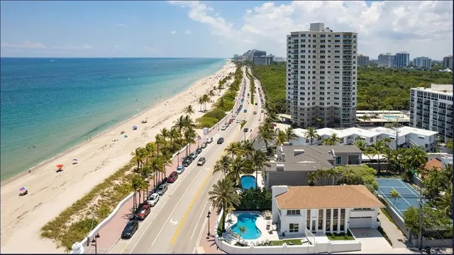 a swimming pool with outdoor seating and yard