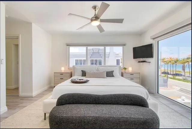 a bathroom with a granite countertop sink toilet a mirror and shower