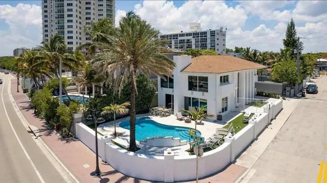 a view of a house with backyard porch and patio