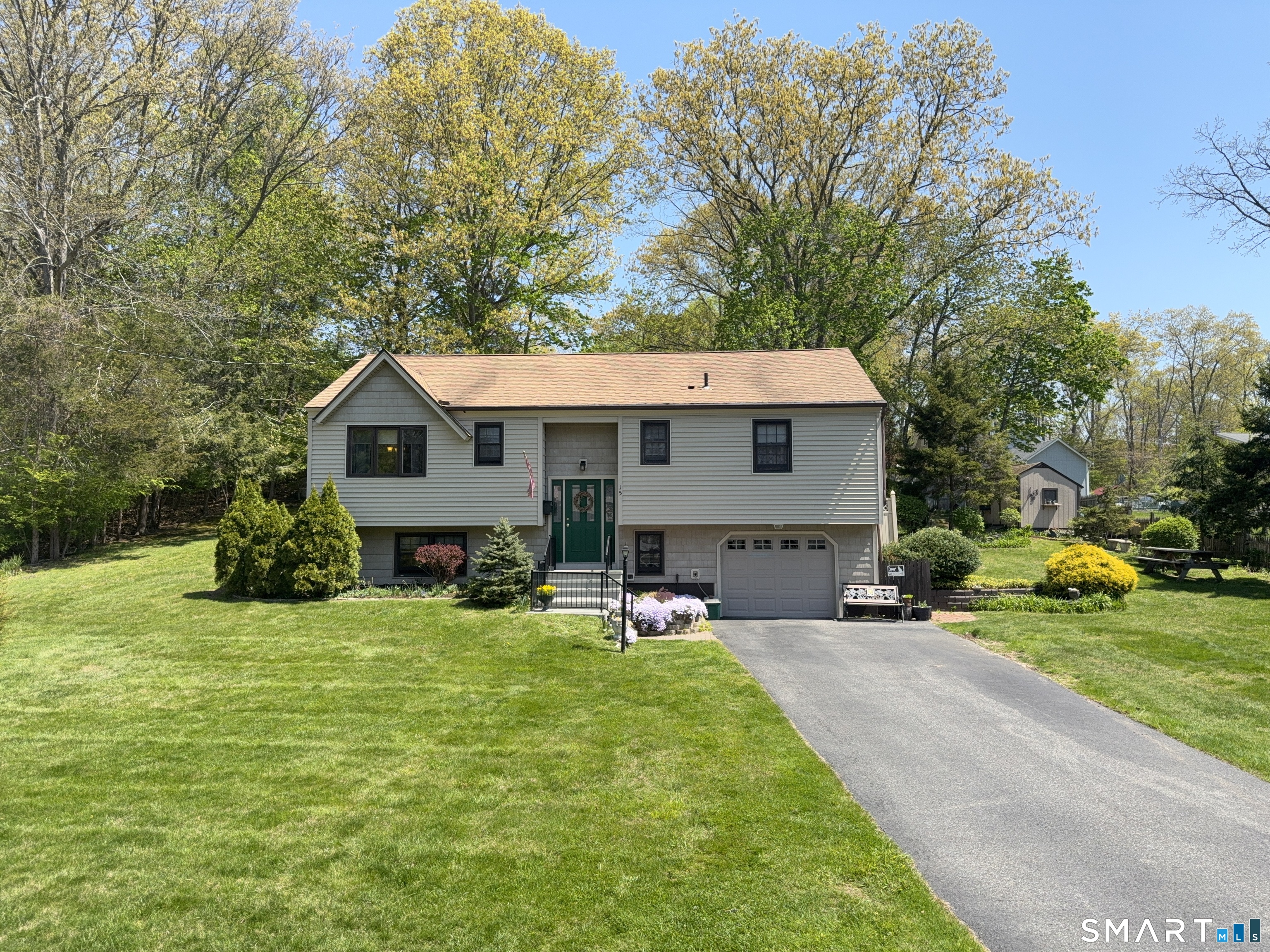 15 Grove Street Deep River, CT 06417 - Photo 23 of 25 a view of a house with a yard patio and fire pit