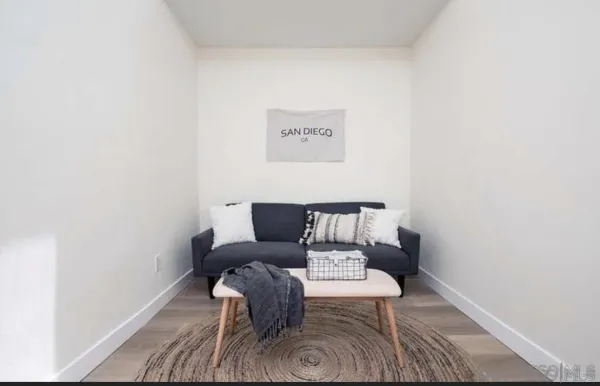 a view of a wooden floor with a rug