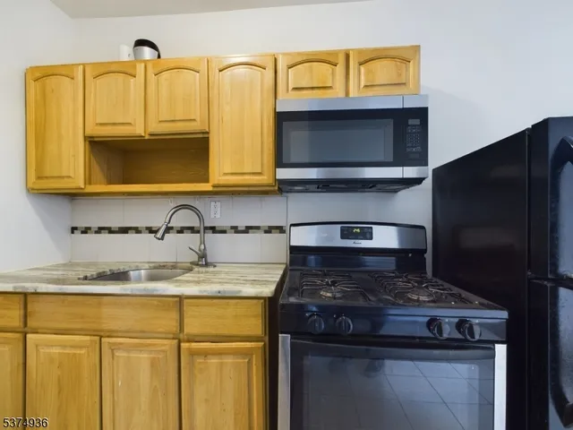 a kitchen with a stove and a microwave