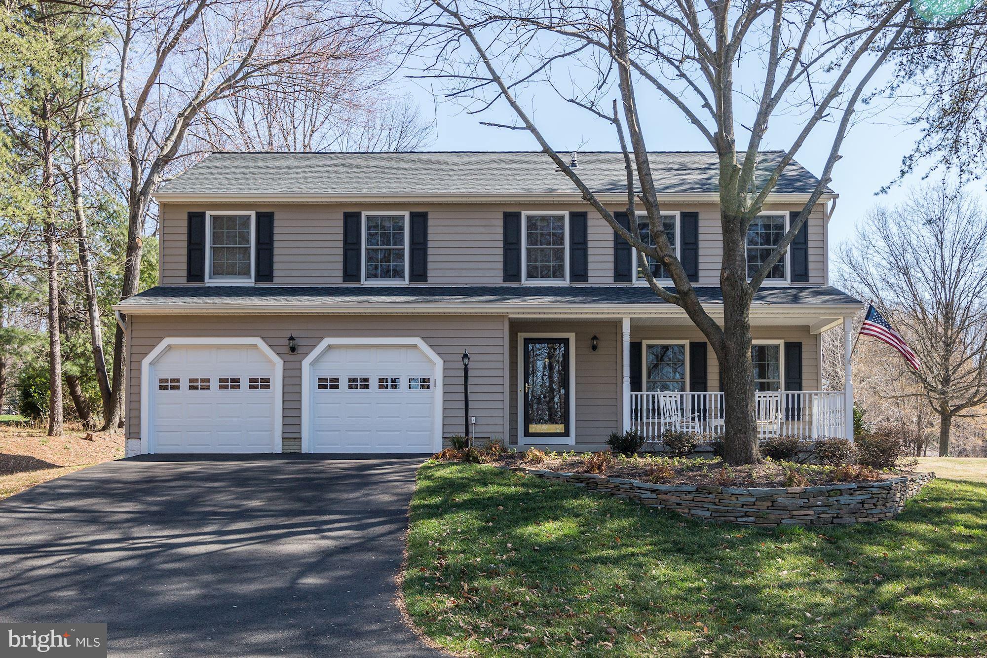 11630 Quail Ridge Court Reston, VA 20194 - Photo 1 of 29 a front view of a house with a garden