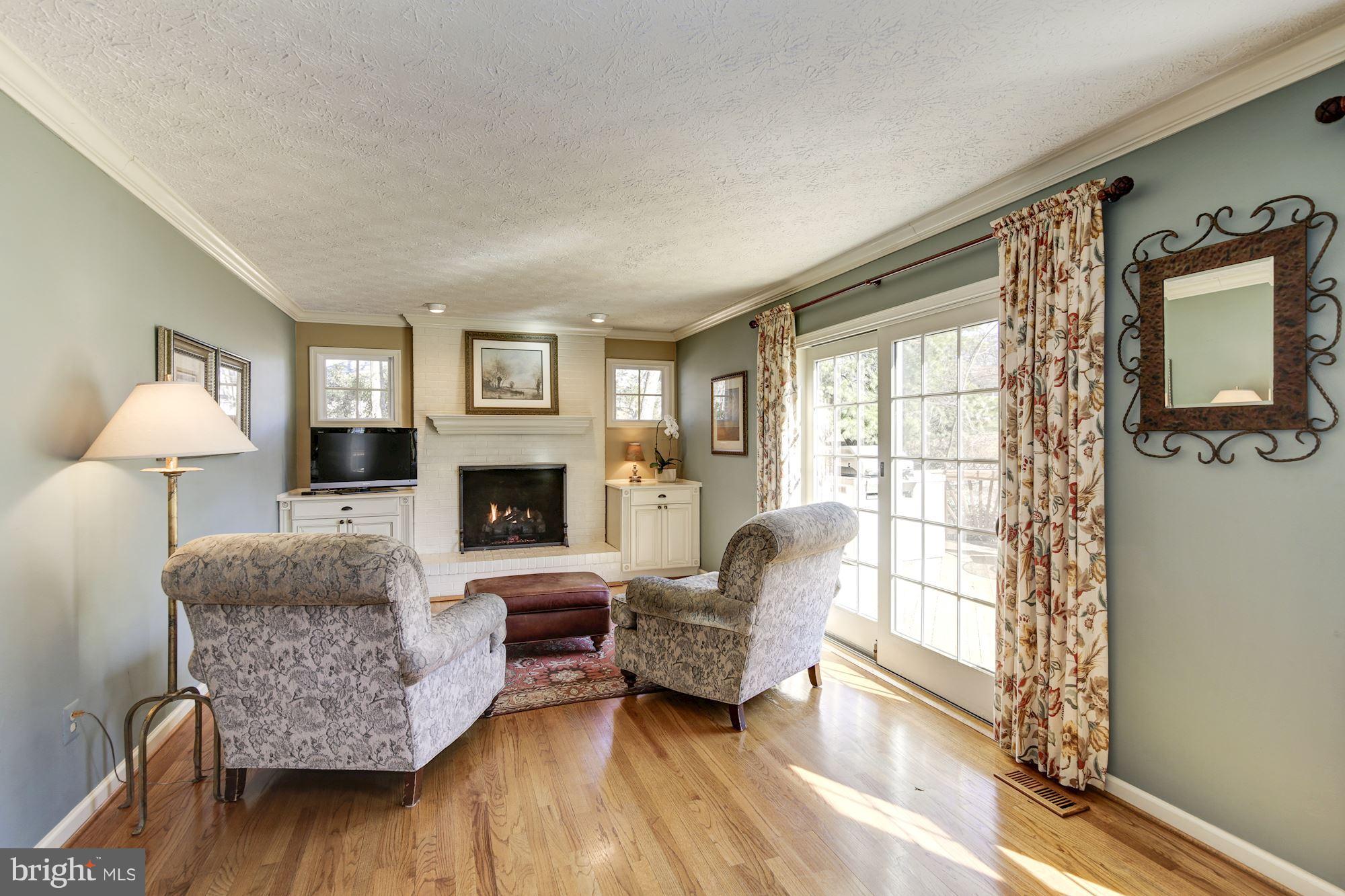 11630 Quail Ridge Court Reston, VA 20194 - Photo 11 of 29 a living room with furniture and a fireplace