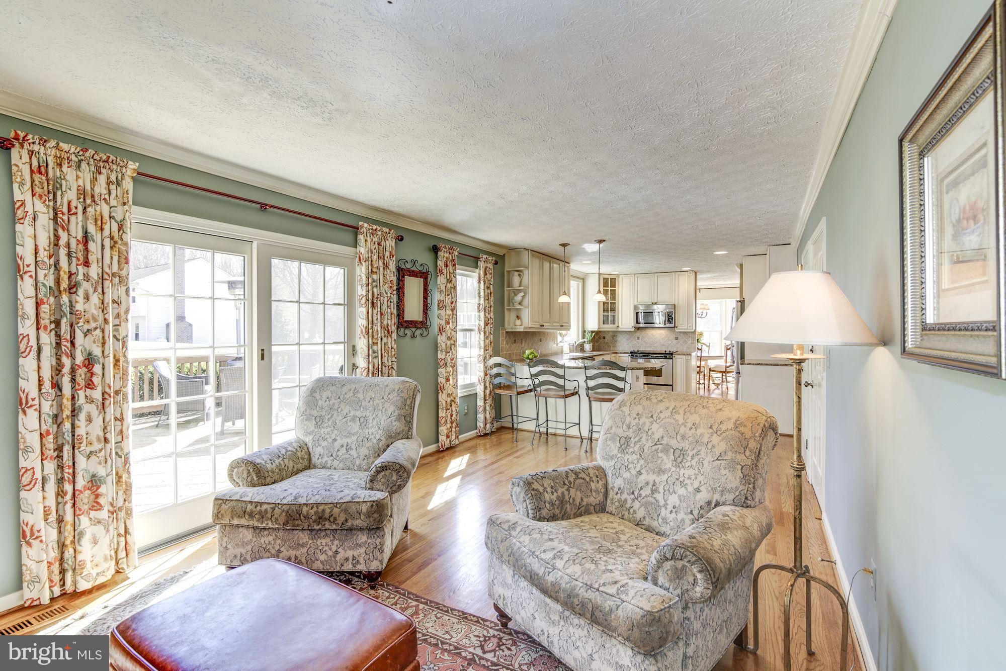 11630 Quail Ridge Court Reston, VA 20194 - Photo 12 of 29 a living room with furniture and a large window