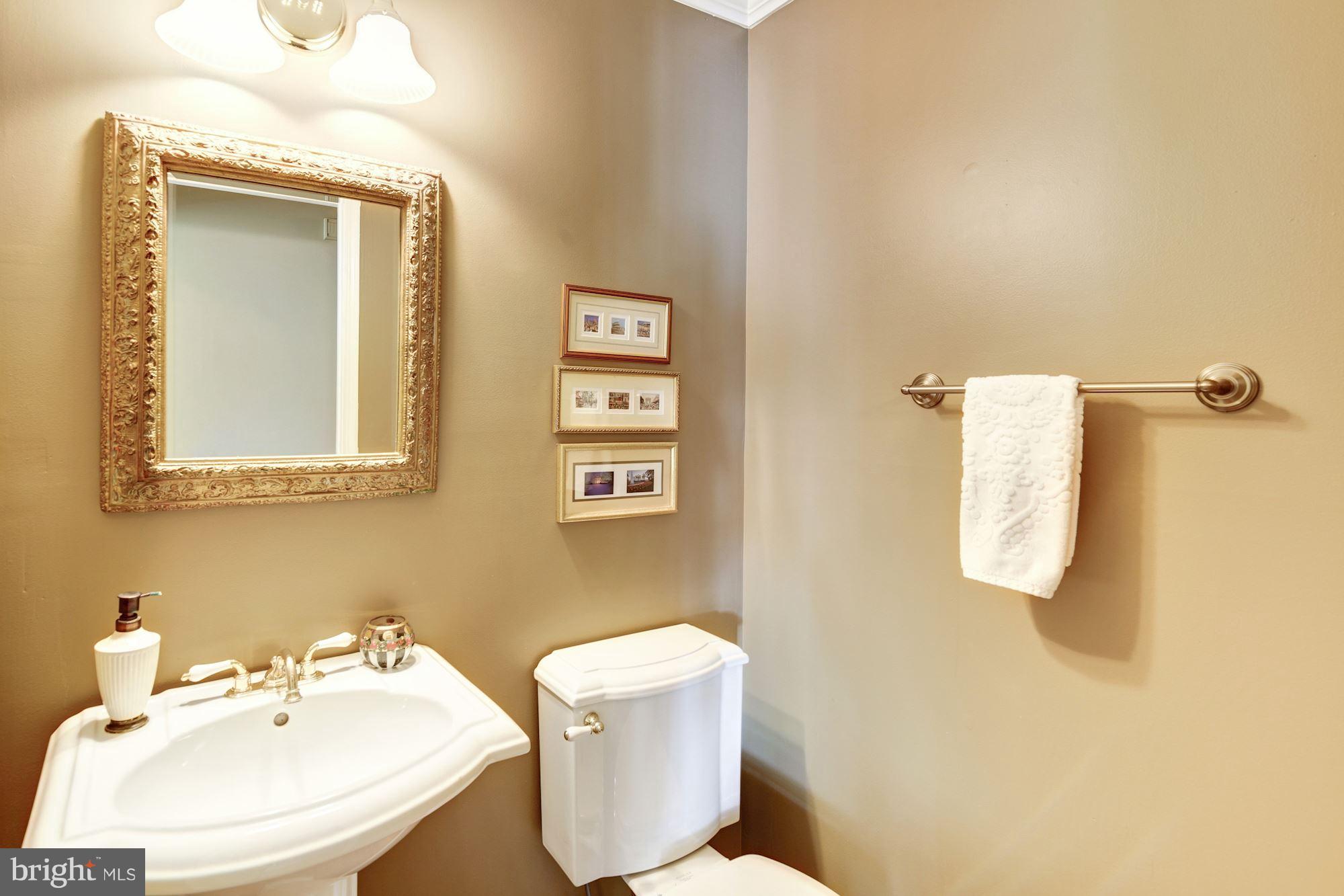 11630 Quail Ridge Court Reston, VA 20194 - Photo 13 of 29 a bathroom with a toilet sink and mirror