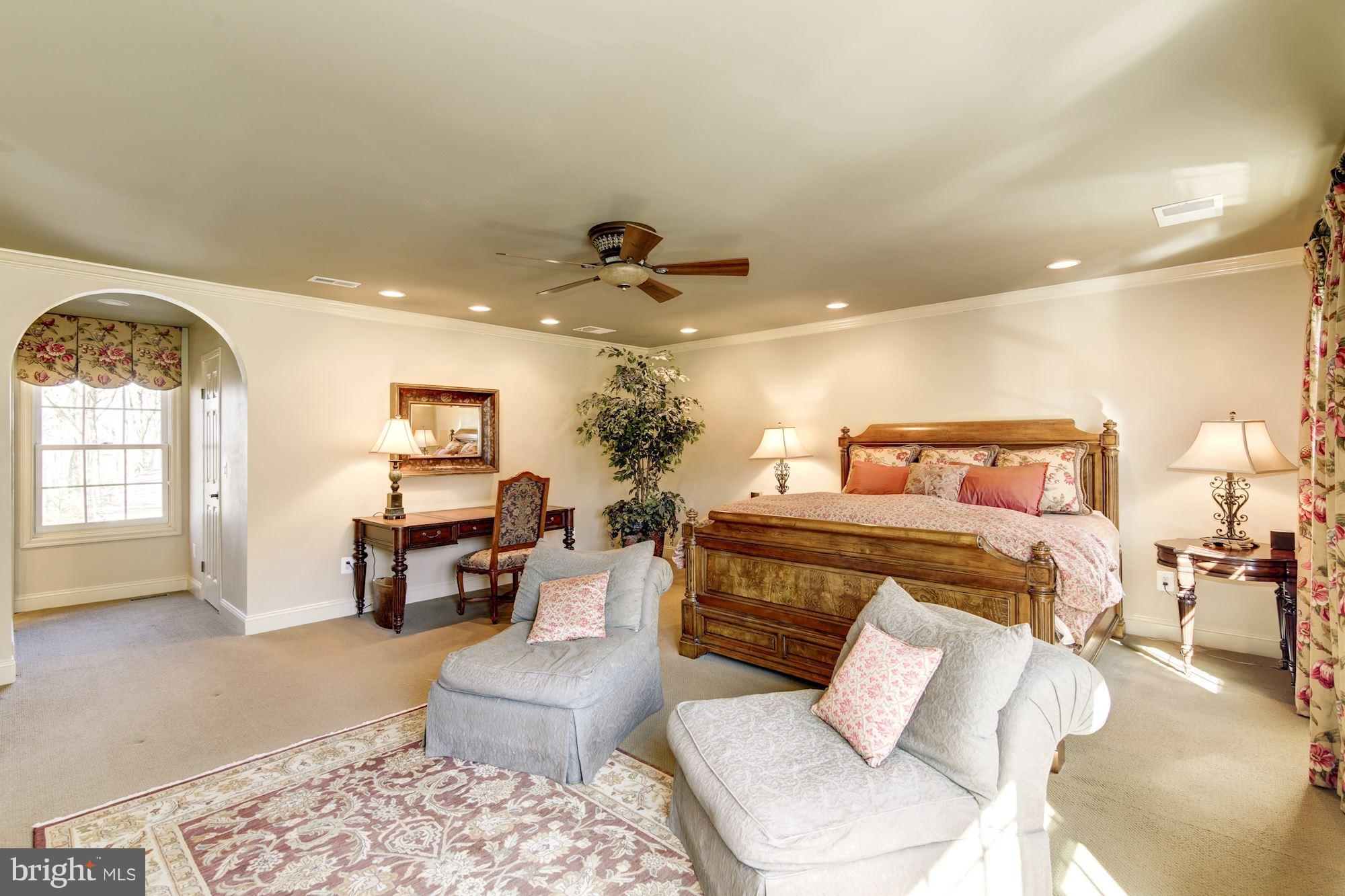 11630 Quail Ridge Court Reston, VA 20194 - Photo 15 of 29 a bedroom with a bed a couch and potted plant with the outer view