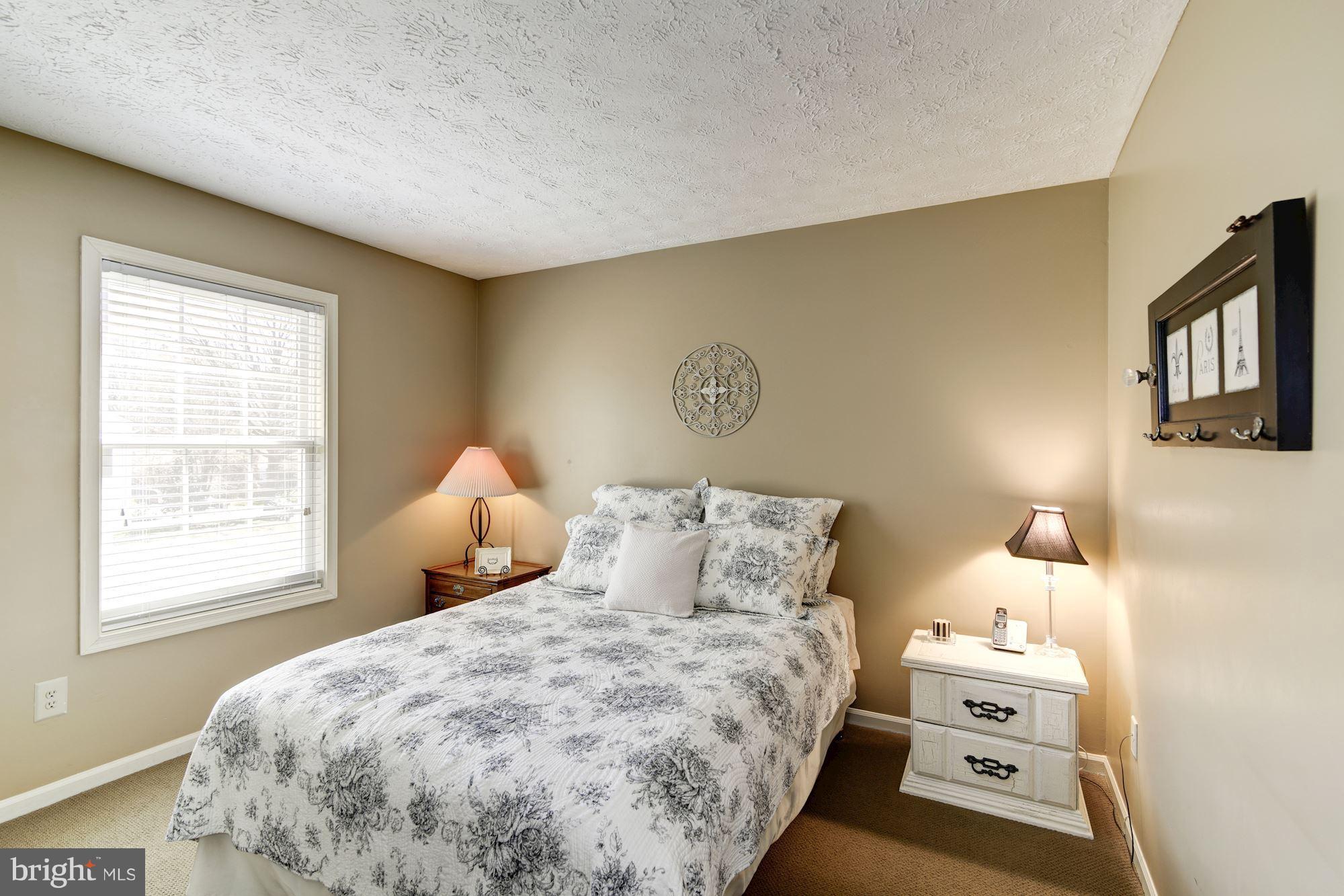 11630 Quail Ridge Court Reston, VA 20194 - Photo 18 of 29 a bedroom with a bed and a window