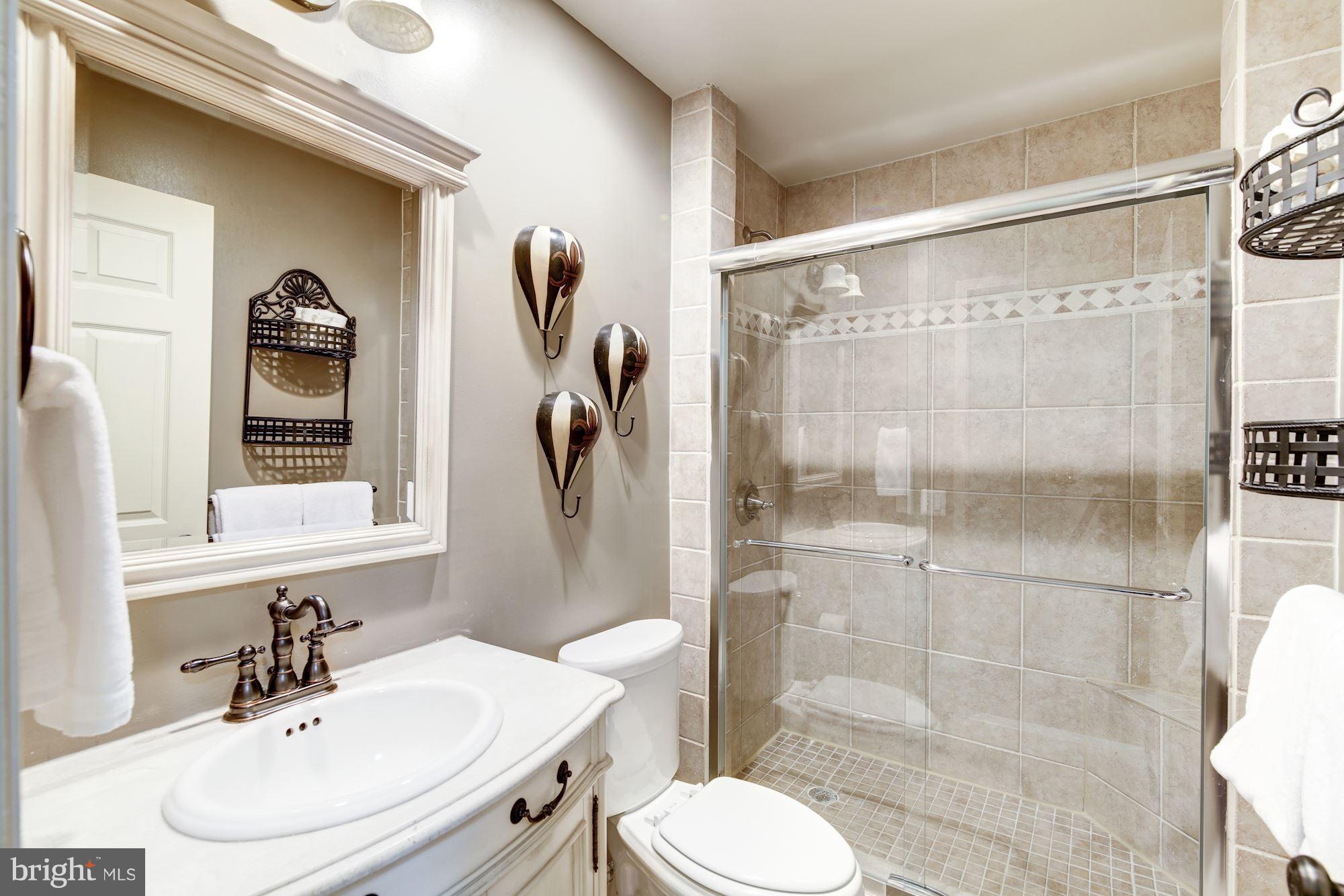 11630 Quail Ridge Court Reston, VA 20194 - Photo 20 of 29 a bathroom with a sink toilet and shower