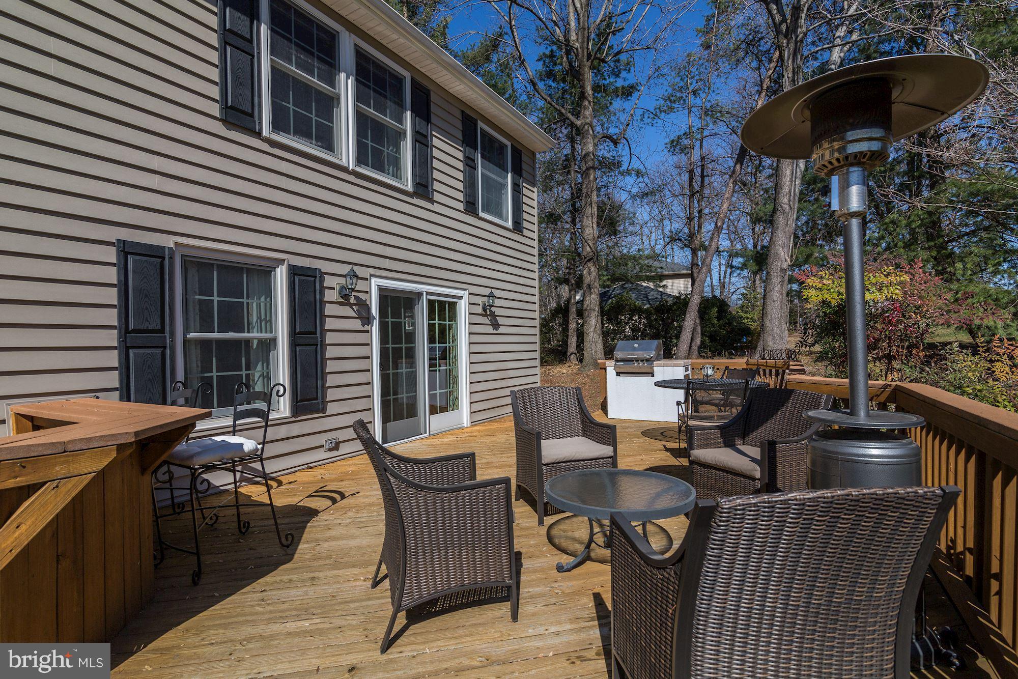 11630 Quail Ridge Court Reston, VA 20194 - Photo 23 of 29 a view of a patio with table and chairs