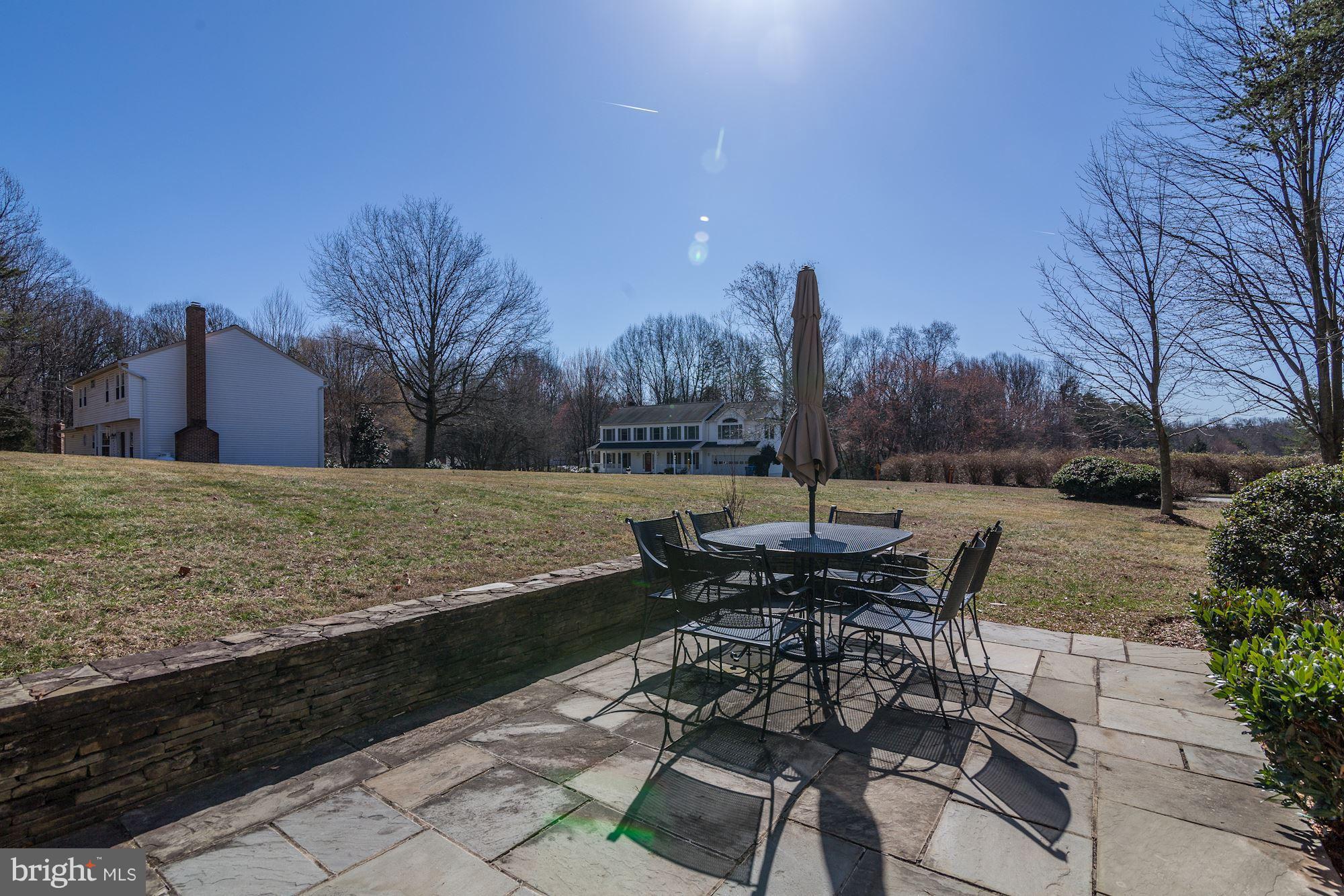 11630 Quail Ridge Court Reston, VA 20194 - Photo 25 of 29 a view of a terrace with furniture and a yard