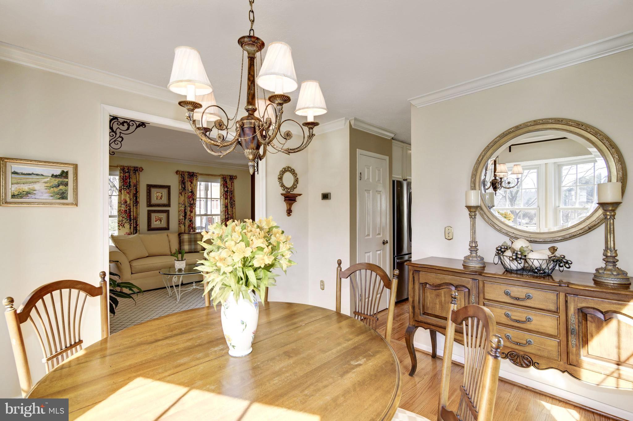 11630 Quail Ridge Court Reston, VA 20194 - Photo 6 of 29 a view of a dining room with furniture and a chandelier