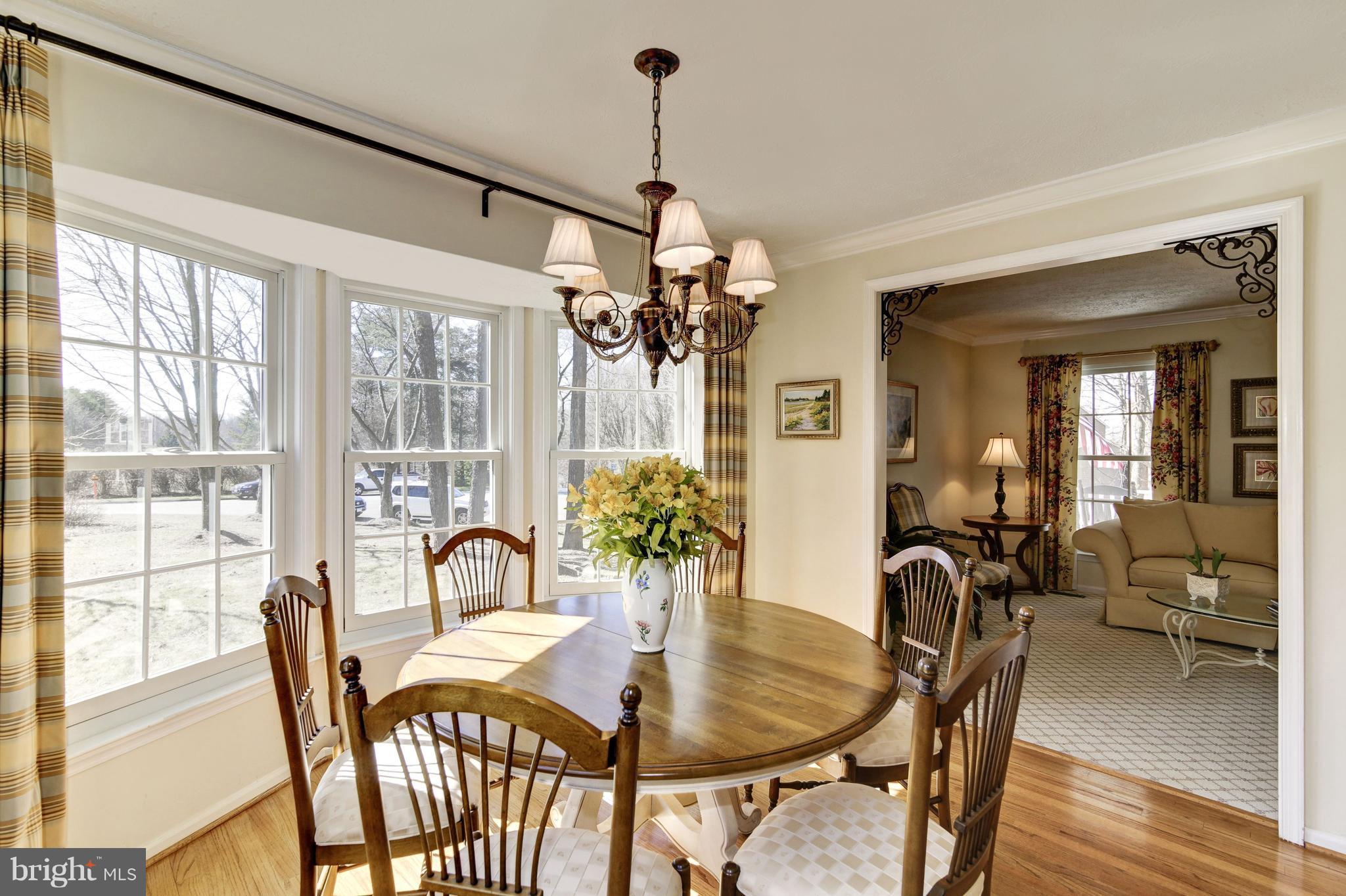11630 Quail Ridge Court Reston, VA 20194 - Photo 7 of 29 a dining room with furniture potted plants and wooden floor