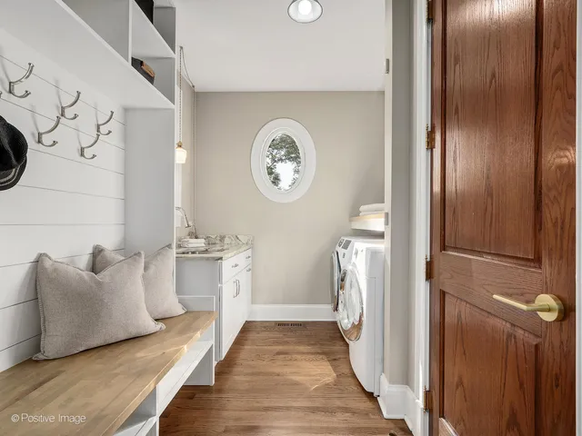 an empty room with a window and a ceiling fan