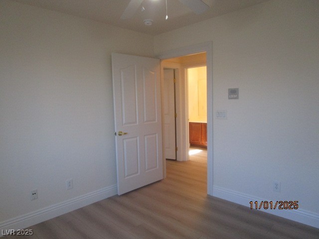8661 Little Fox Street Las Vegas, NV 89123 - Photo 12 of 18 Empty room with wood finished floors and ceiling fan