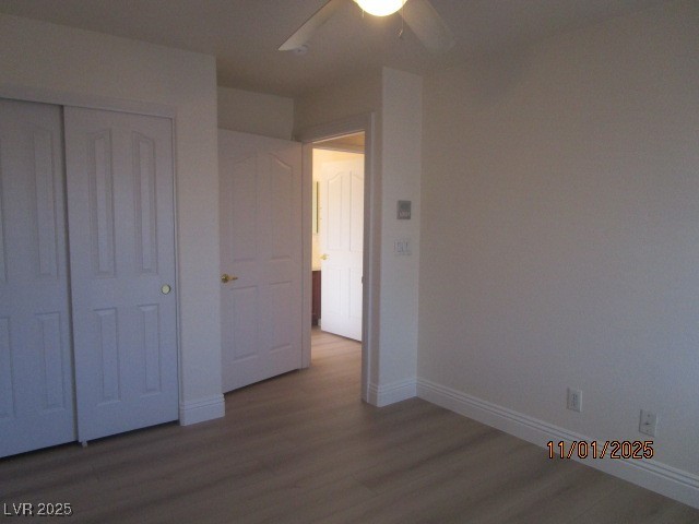 8661 Little Fox Street Las Vegas, NV 89123 - Photo 14 of 18 Unfurnished bedroom featuring dark wood-style floors, a closet, and ceiling fan