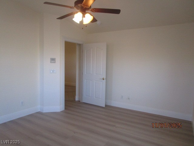 8661 Little Fox Street Las Vegas, NV 89123 - Photo 8 of 18 Empty room featuring wood finished floors and ceiling fan