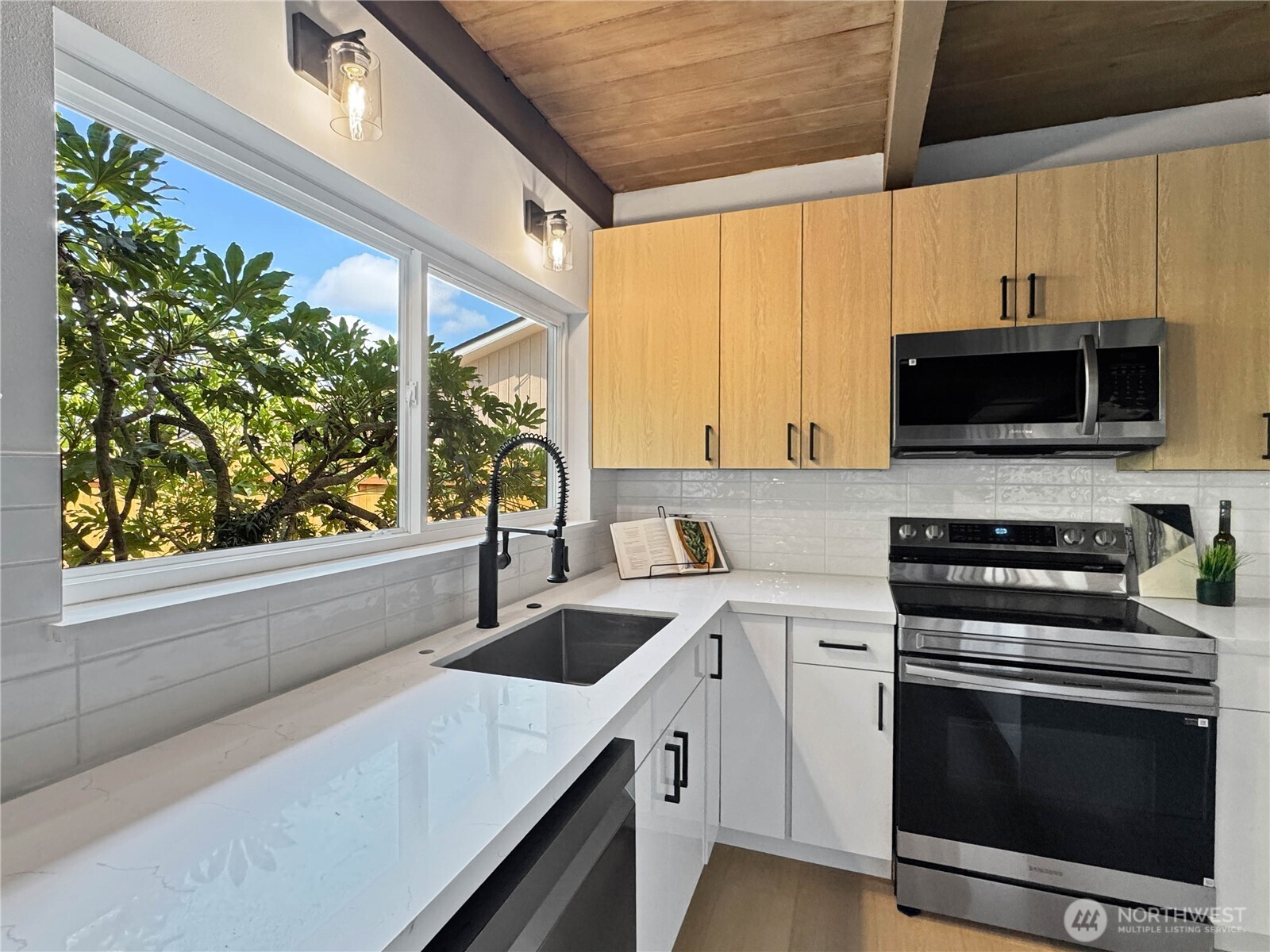 324 Valley Avenue Sumner, WA 98390 - Photo 11 of 34 a kitchen with a sink a stove and cabinets