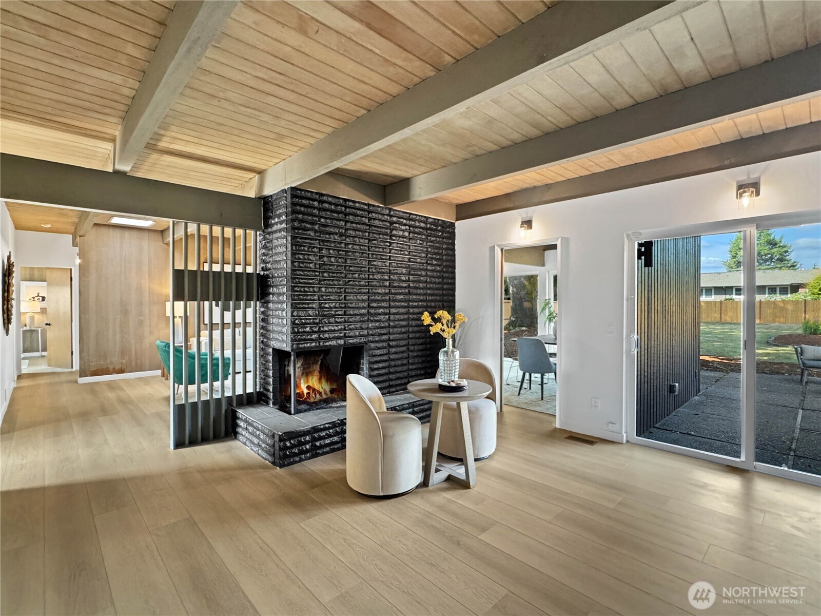 324 Valley Avenue Sumner, WA 98390 - Photo 13 of 34 a living room with furniture a fireplace and a wooden floor