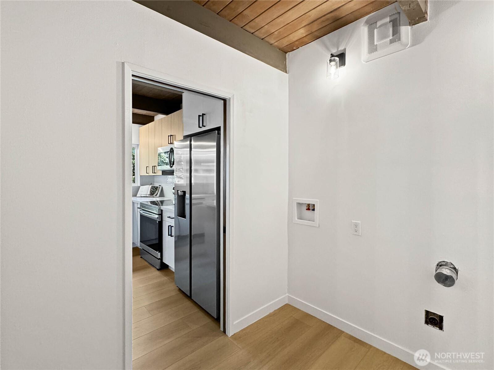 324 Valley Avenue Sumner, WA 98390 - Photo 15 of 34 a view of a hallway with wooden floor and closet