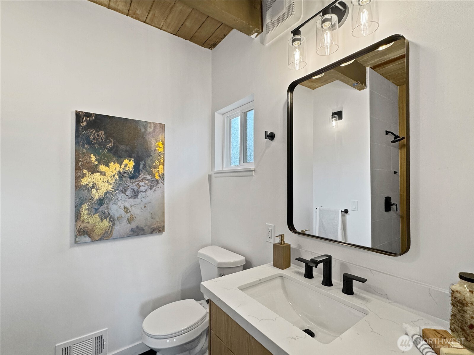 324 Valley Avenue Sumner, WA 98390 - Photo 22 of 34 a bathroom with a sink vanity mirror and toilet