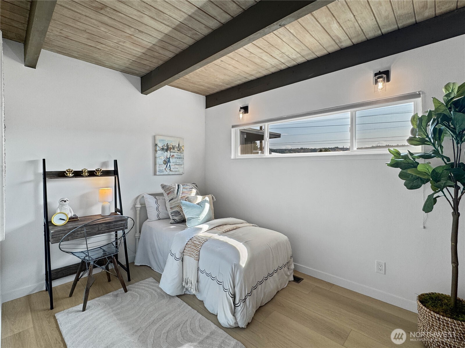 324 Valley Avenue Sumner, WA 98390 - Photo 25 of 34 a bedroom with a bed and a potted plant on the dresser