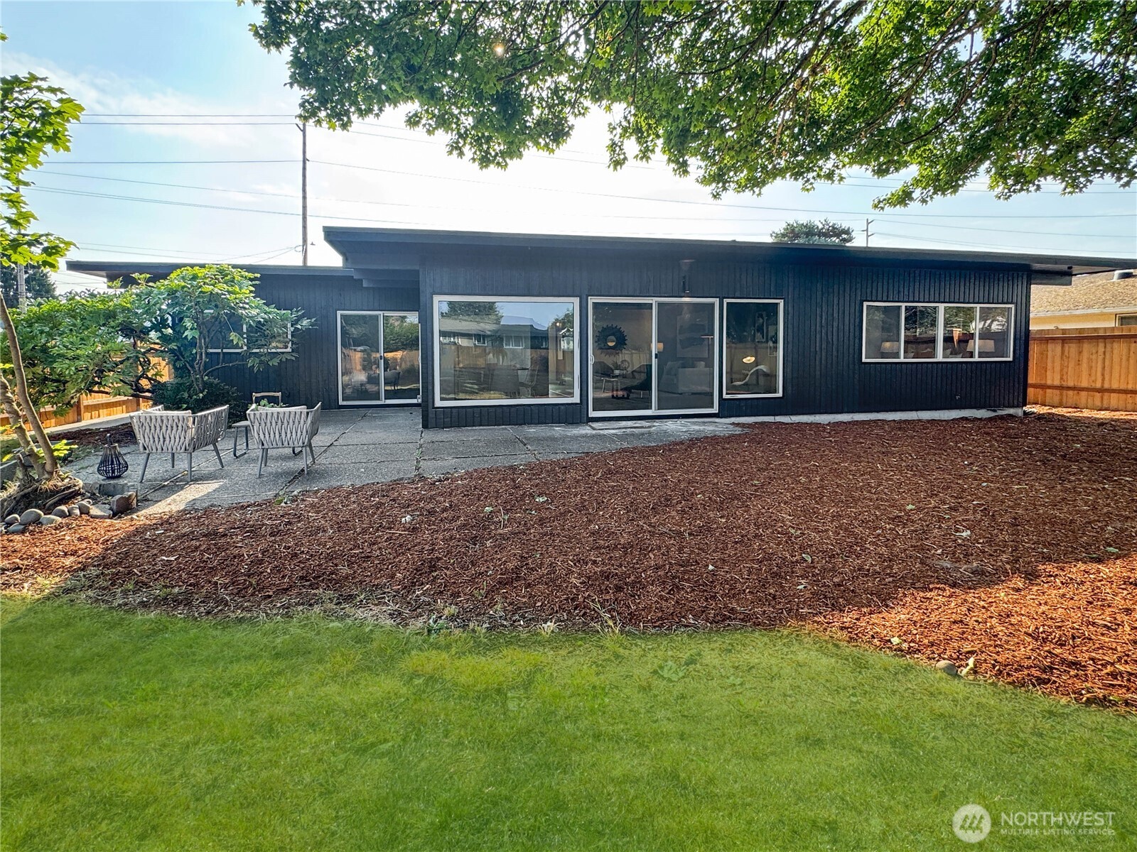 324 Valley Avenue Sumner, WA 98390 - Photo 28 of 34 a front view of a house with a garden