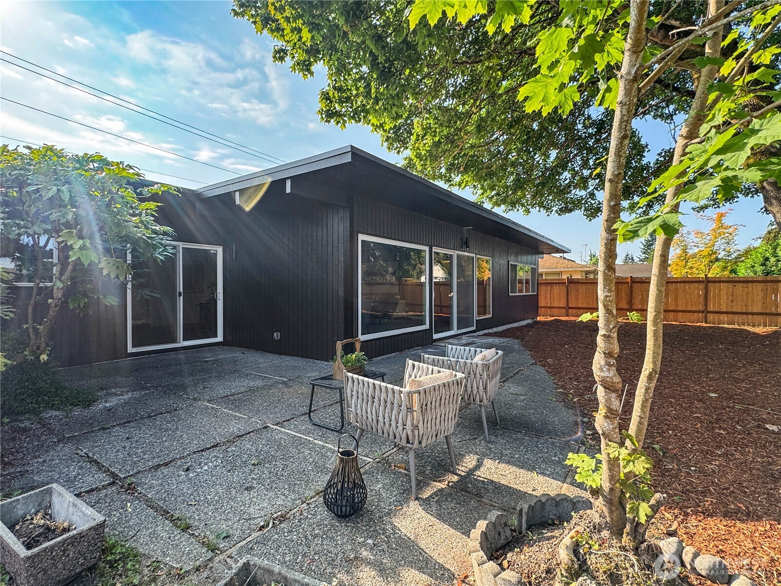 324 Valley Avenue Sumner, WA 98390 - Photo 29 of 34 a house with trees in front of it