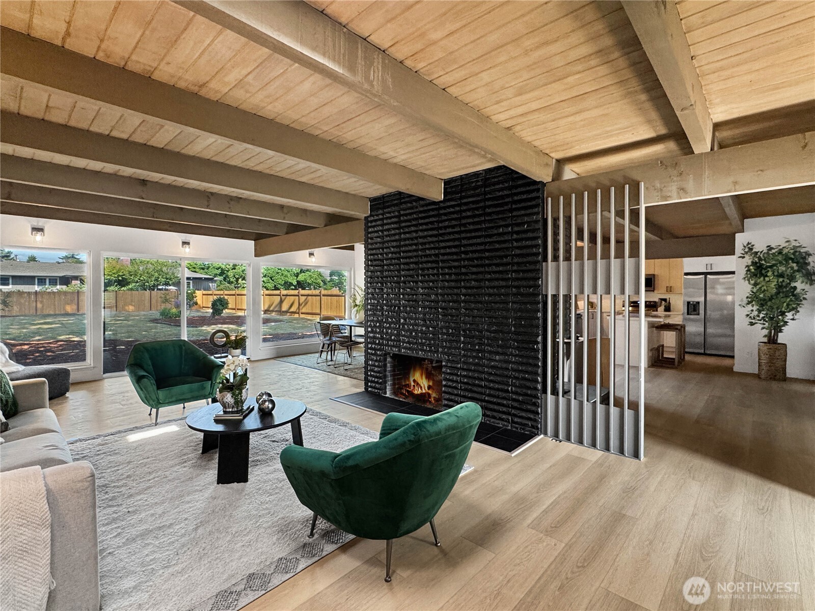 324 Valley Avenue Sumner, WA 98390 - Photo 7 of 34 a view of a patio with couches chairs and potted plants