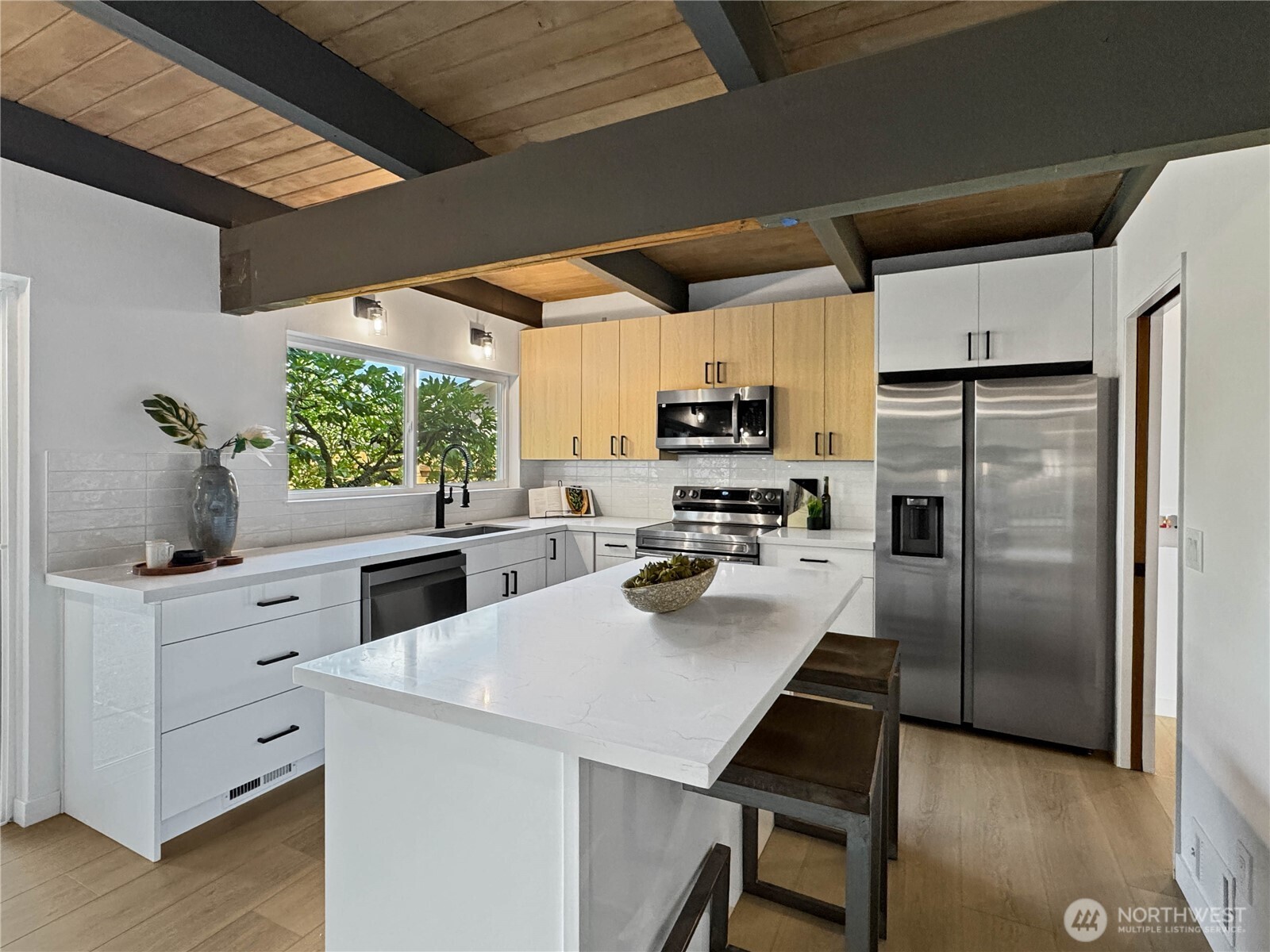 324 Valley Avenue Sumner, WA 98390 - Photo 9 of 34 a kitchen with a refrigerator a stove cabinets and furniture