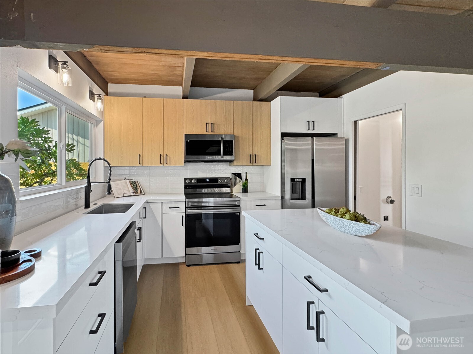 324 Valley Avenue Sumner, WA 98390 - Photo 10 of 34 a kitchen with stainless steel appliances a sink stove and refrigerator