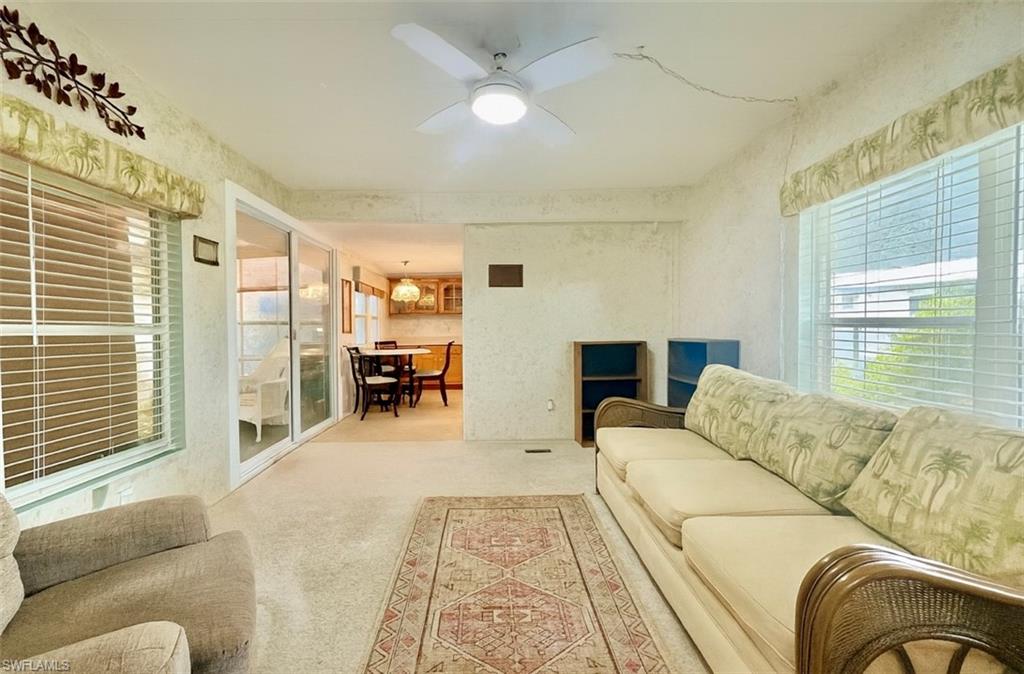 112 Cape Sable Drive Naples, FL 34104 - Photo 15 of 35 a living room with furniture and a large window