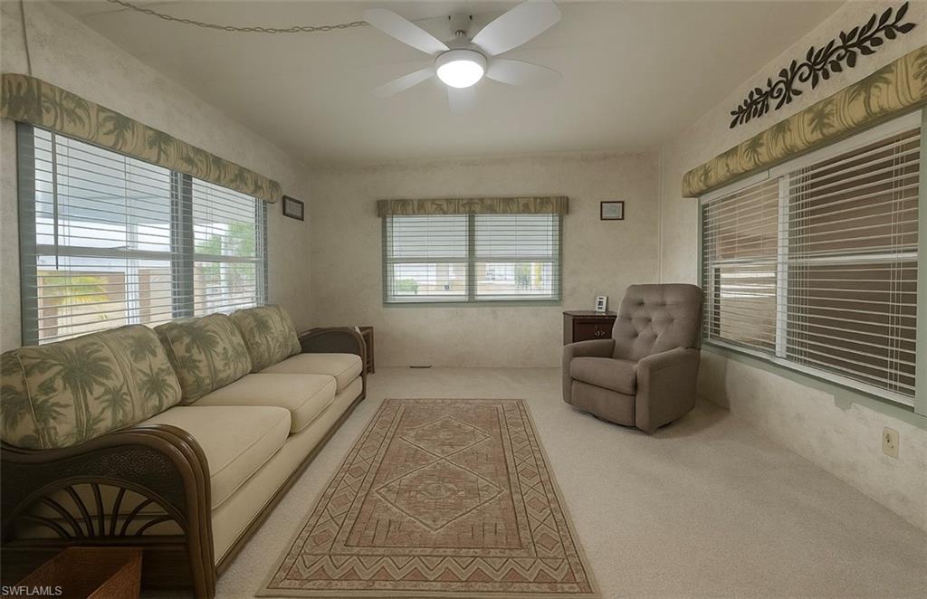 112 Cape Sable Drive Naples, FL 34104 - Photo 16 of 35 a living room with furniture and a window