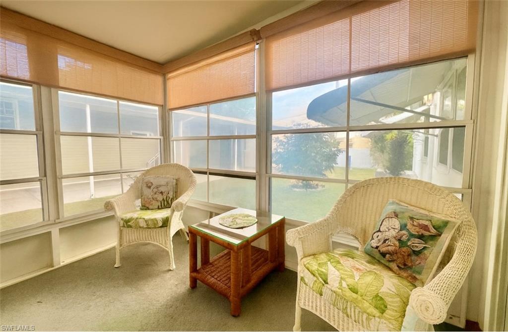 112 Cape Sable Drive Naples, FL 34104 - Photo 18 of 35 a living room with furniture and a large window