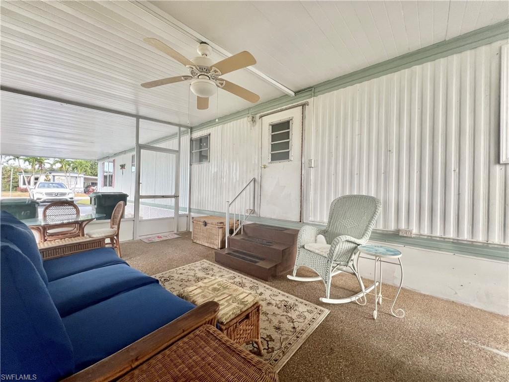 112 Cape Sable Drive Naples, FL 34104 - Photo 22 of 35 a living room with furniture and wooden floor