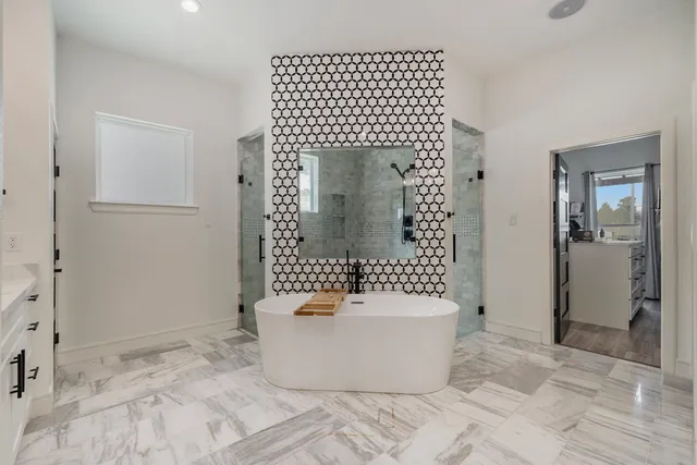 a white bath tub sitting in a bathroom